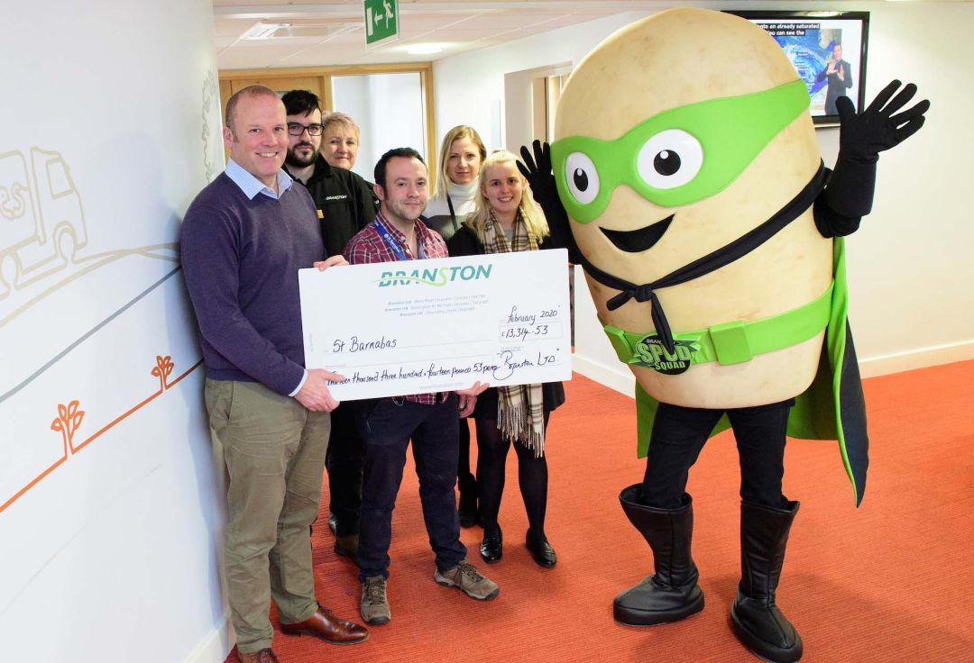 Branston presents fundraising cheque to St Barnabas